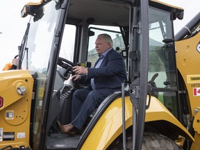 Ontario Premier Doug Ford is pictured at a construction site in Brampton at the start of last spring's election campaign on May 4, 2022.