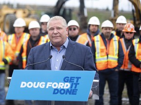 Ontario Premier Doug Ford talks to the media on a construction site in Brampton as he starts his re-election campaign on Wednesday, May 4, 2022.