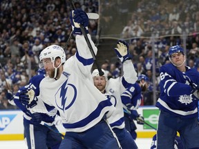 Tampa Bay Lightning's Victor Hedman celebrates his goal against the Maple Leafs with teammate Steven Stamkos during the first period of Game 2 in Toronto on Wednesday, May 4, 2022.