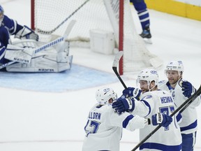 Tampa Bay Lightning defenceman Victor Hedman celebrates his goal with teammates Alex Killorn and Steven Stamkos after scoring past Maple Leafs goaltender Jack Campbell during the first period in Game 2 on Wednesday, May 4, 2022.