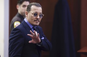Johnny Depp reacts on Thursday, May 5, 2022, as he departs for a break at the Fairfax County Circuit Court in Fairfax, Virginia.