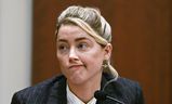 Amber Heard testifies in the courtroom at the Fairfax County Circuit Courthouse in Fairfax, Va., Tuesday, May 17, 2022.  to herself as a 