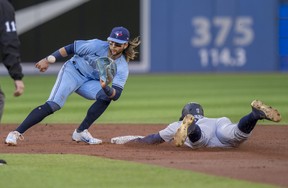 Seattle Mariners' Julio Rodriguez steals second base as Blue Jays shortstop Bo Bichette waits for the throw during the second inning in Toronto on Tuesday, May 17, 2022. FRANK GUNN/THE CANADIAN PRESS