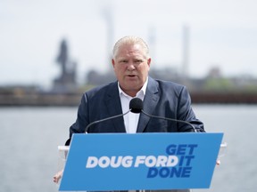 Premier Doug Ford makes an announcement on the with Stelco as a backdrop during an election campaign stop in Hamilton on Wednesday, May 18, 2022.