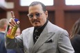 Johnny Depp appears in the courtroom during a break at the Fairfax County Circuit Courthouse in Fairfax, Va., Thursday, May 19, 2022.