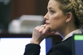 Amber Heard listens in the courtroom at the Fairfax County Circuit Courthouse in Fairfax, Va., May 19, 2022.