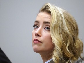 Amber Heard listens in the courtroom at the Fairfax County Circuit Courthouse in Fairfax, Va., Monday, May 23, 2022.