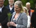 Then minister of environment and climate change, Catherine McKenna holds a sapling during a funding announcement to support Forests Ontario in planting 50 million trees by 2025, on World Environment Day at the Dominion Arboretum in Ottawa on Wednesday, June 5, 2019.