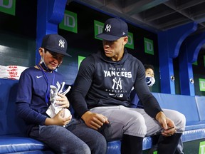 Fan Derek Rodriguez, 9, reacts while meeting Aaron Judge of the New York Yankees prior to a game against the Blue Jays at Rogers Centre in Toronto on Wednesday, May 4, 2022.