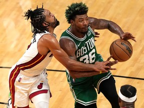 Gabe Vincent of the Miami Heat knocks the ball away from Marcus Smart of the Boston Celtics during Game 2 of the Eastern Conference Finals at FTX Arena on May 19, 2022 in Miami.