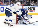Maple Leafs goaltender Jack Campbell makes a save after being hit by Lightning forward Corey Perry in Game 1 of the 2022 Stanley Cup playoffs at the Scotiabank Arena in Toronto, Monday, May 2, 2022.