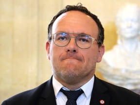 French Member of Parliament Damien Abad talks to the media after a session of questions to the government at the National Assembly in Paris April 29, 2020.