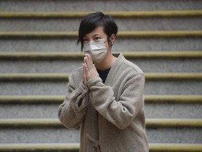 Hong Kong activist and music star Denise Ho bows as she is released from Western Police Station after more than 24 hours in custody, Dec. 30. 2021.