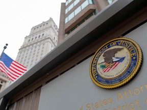 The seal of the United States Department of Justice is seen on the building exterior in Manhattan August 17, 2020.