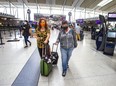 Dawn Clelland (left) and Laurie Stockie arrived four hours early for their flight to Florida at Terminal 1 at Toronto Pearson International Airport on Tuesday, May 3, 2022.