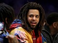 J. Cole watches the action during the NBA All-Star game as part of the 2019 NBA All-Star Weekend at Spectrum Center on February 17, 2019 in Charlotte, North Carolina.