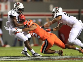 Zonovan Knight of the North Carolina State Wolfpack is hit by Tyrell Richards of the Syracuse Orange during a 2019 games in Raleigh, North Carolina. Richards, from Brampton, was the first overall pick in the 2022 CFL draft on Tuesday night.