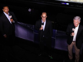 In this file photo taken on Aug. 1, 2020, commentators Mark Jackson, left, Jeff Van Gundy, centre, and Mike Breen talk prior to game between the Miami Heat and the Denver Nuggets at HP Field House at ESPN Wide World Of Sports Complex in Lake Buena Vista, Fla.