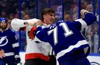 Ottawa Senators' Alex Formenton #10 and Tampa Bay Lightning's Anthony Cirelli #71 battle in the third period during a game at Amalie Arena on March 1, 2022 in Tampa, Florida.  (Photo by Mike Ehrmann/Getty Images)