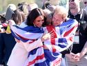 Prince Harry, Duke of Sussex and Meghan, Duchess of Sussex hug Lisa Johnston of Team United Kingdom at the Athletics Competition during day two of the Invictus Games The Hague 2020 at Zuiderpark on April 17, 2022 in The Hague, Netherlands. (Photo by Chris Jackson/Getty Images for the Invictus Games Foundation)