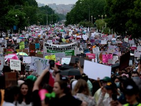 Abortion-rights demonstrators walk down Constitution Avenue during the Bans Off Our Bodies march on May 14, 2022 in Washington, DC.