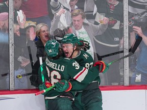 Minnesota Wild left wing Kirill Kaprizov (97) celebrates his hat trick with right wing Mats Zuccarello (36) against the St. Louis Blues in the third period in game two of the first round of the 2022 Stanley Cup Playoffs at Xcel Energy Center May 4, 2022.