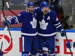 Toronto Maple Leafs defenseman Morgan Rielly (44) celebrates his goal against the Tampa Bay Lightning with forward John Tavares (91) during the third period of game five of the first round of the 2022 Stanley Cup Playoffs at Scotiabank Arena.