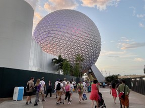 A view of Spaceship Earth, which serves as the entrance plaza for Epcot, at sunset.