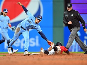 Blue Jays second baseman Santiago Espinal tags out Guardians' Oscar Mercado trying to steal second to end the eighth inning at Progressive Field on Thursday, May 5, 2022 in Cleveland.