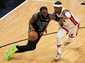 Jaylen Brown of the Boston Celtics is defended by Jimmy Butler of the Miami Heat during the third quarter  in Game 5  of the 2022 NBA Playoffs Eastern Conference Finals at FTX Arena on May 25, 2022 in Miami, Fla., May 25, 2022.