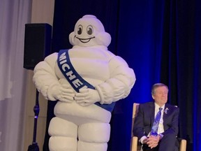 Toronto Mayor John Tory with the famous Michelin Man at the press conference announcing the arrival of the Michelin Guide to Canada.