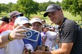 Jordan Spieth takes a selfie with a fan on Wednesday following a practice round for this PGA Championship, which begins Thursday at Southern Hills Country Club in Tulsa, Okla.
