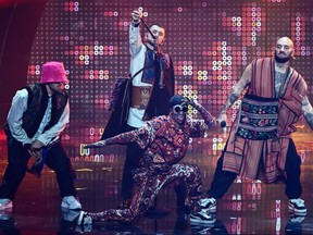 Members of the band "Kalush Orchestra" perform on behalf of Ukraine during the final of the Eurovision Song contest 2022 on May 14, 2022 at the Pala Alpitour venue in Turin.