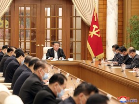 North Korean leader Kim Jong Un chairs a Worker's Party meeting on the COVID-19 outbreak response in this undated photo released by North Korea's Korean Central News Agency, Thursday, May 12, 2022.