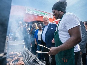 PC candidate Patrice Barnes and Ontario Premier Doug Ford enjoy a spicy lunch cooked by Chef Kavanaugh Wright at Courtney's Restaurant and Bar in Ajax on Thursday, May 5, 2022.