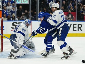 Tampa Bay Lightning defenseman Ryan McDonagh clears Toronto Maple Leafs forward David Kampf away from the net as Tampa Bay Lightning goaltender Andrei Vasilevskiy makes a save during the first period of Game 2 of the first round of the 2022 Stanley Cup Playoffs at Scotiabank Arena in Toronto, May 4, 2022.