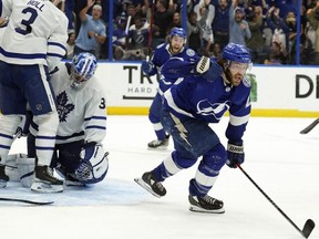 Tampa Bay Lightning centre Brayden Point (21) celebrates after scoring on Leafs goalie Jack Campbell during sudden-death overtime in Tampa, Fla., Thursday night. (AP Photo/Chris O'Meara)