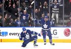Mitch Marner of the Maple Leafs (left) celebrates with Auston Matthews after scoring a goal against the Tampa Bay Lightning in game one of the first round of the Stanley Cup playoffs at Scotiabank Arena on Monday, May 2, 2022. 
