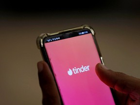 The dating app Tinder is shown on a mobile phone in this picture illustration.
