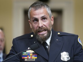 Washington Metropolitan Police Department officer Michael Fanone bangs his fist on the witness table as he testifies during the House Select Committee investigating the January 6 attack on the U.S. Capitol on July 27, 2021.