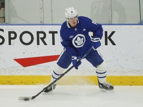 Maple Leafs' Mitch Marner looks to make a pass during practice in Toronto on Friday, April 1, 2022.