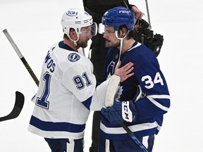 Maple Leafs star Auston Matthews (right) shakes hands with Tampa Bay Lightning captain Steven Stamkos after Toronto was knocked out of the playoffs on Saturday night at Scotiabank Arena.