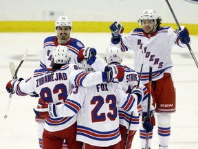 The Rangers celebrate a goal by centre Mika Zibanejad (93) against the Penguins during the second period in Game 6 of the first round of the 2022 Stanley Cup Playoffs at PPG Paints Arena in Pittsburgh, May 13, 2022.