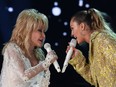 Dolly Parton and Miley Cyrus perform osntage during the 61st Annual Grammy Awards on Feb. 10, 2019 in Los Angeles.