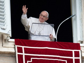Pope Francis waves during Regina Caeli prayer, in Saint Peter's Square at the Vatican, May 1, 2022.
