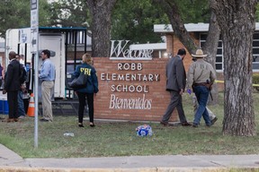 Law enforcement work the scene after a mass shooting at Robb Elementary School where 19 people, including 18 children, were killed on May 24, 2022 in Uvalde, Texas.