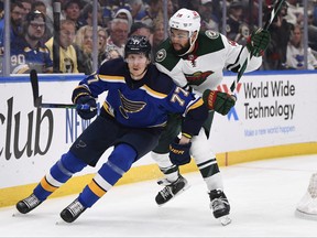 Minnesota Wild left wing Nicolas Deslauriers pressures St. Louis Blues defenseman Niko Mikkola during the second period in Game 4  of the first round of the 2022 Stanley Cup Playoffs at Enterprise Center in St. Louis, Miss., May 8, 2022.