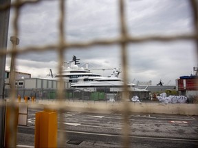 A view shows the multi-million-dollar mega yacht Scheherazade (rear centre), docked at the Tuscan port of Marina di Carrara, Tuscany, on May 6, 2022, after its basin was reflooded.