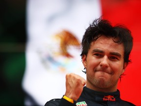 Race winner Sergio Perez of Mexico and Oracle Red Bull Racing celebrates on the podium during the F1 Grand Prix of Monaco at Circuit de Monaco on May 29, 2022 in Monte-Carlo, Monaco.