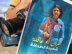 A Palestinian journalist protests the death of veteran Al-Jazeera journalist Shireen Abu Akleh, who was shot dead while covering an Israeli army raid in Jenin, in the West Bank biblical city of Bethlehem on May 11, 2022.